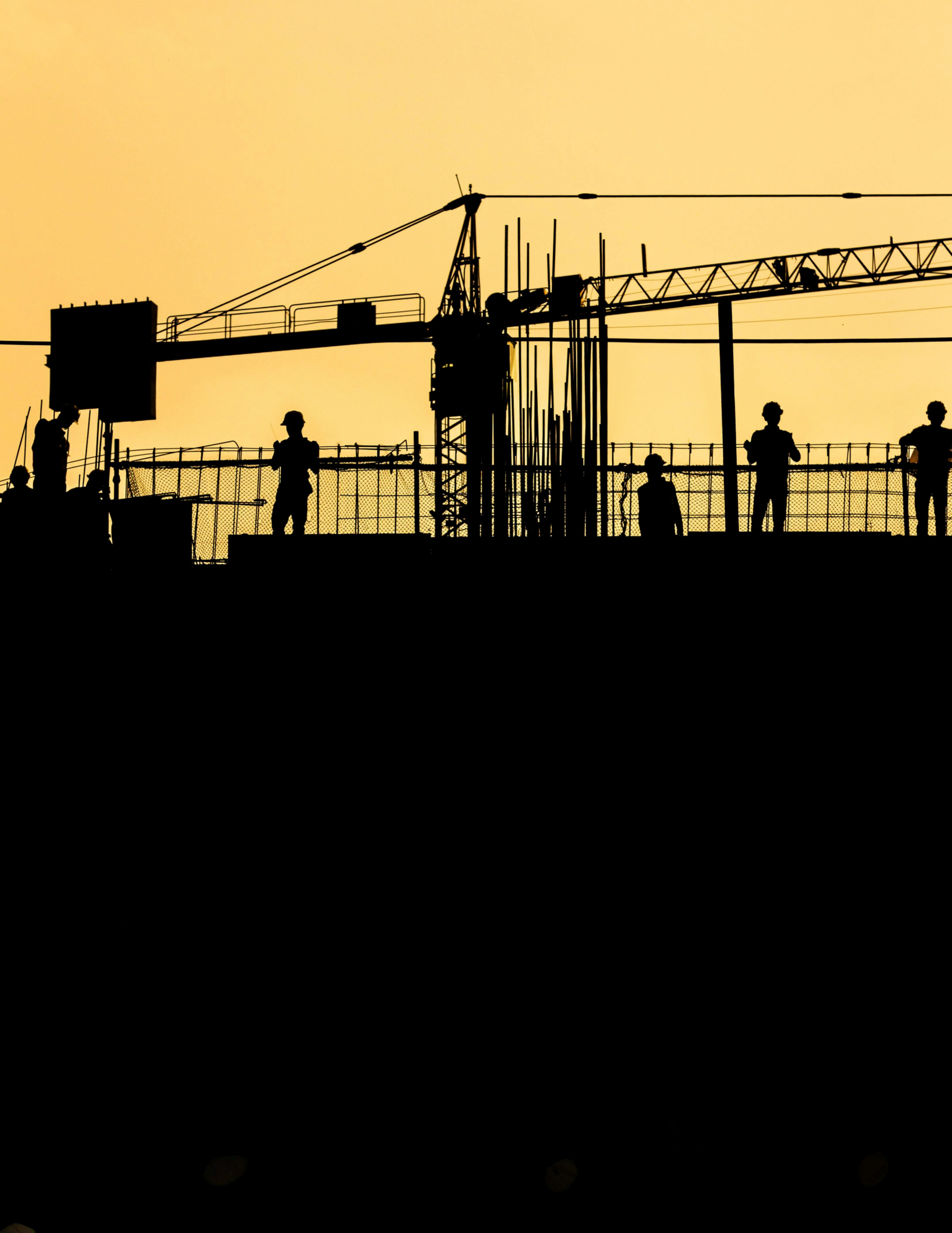 EHS worker safety on building site – portrait – silhouette – sunset